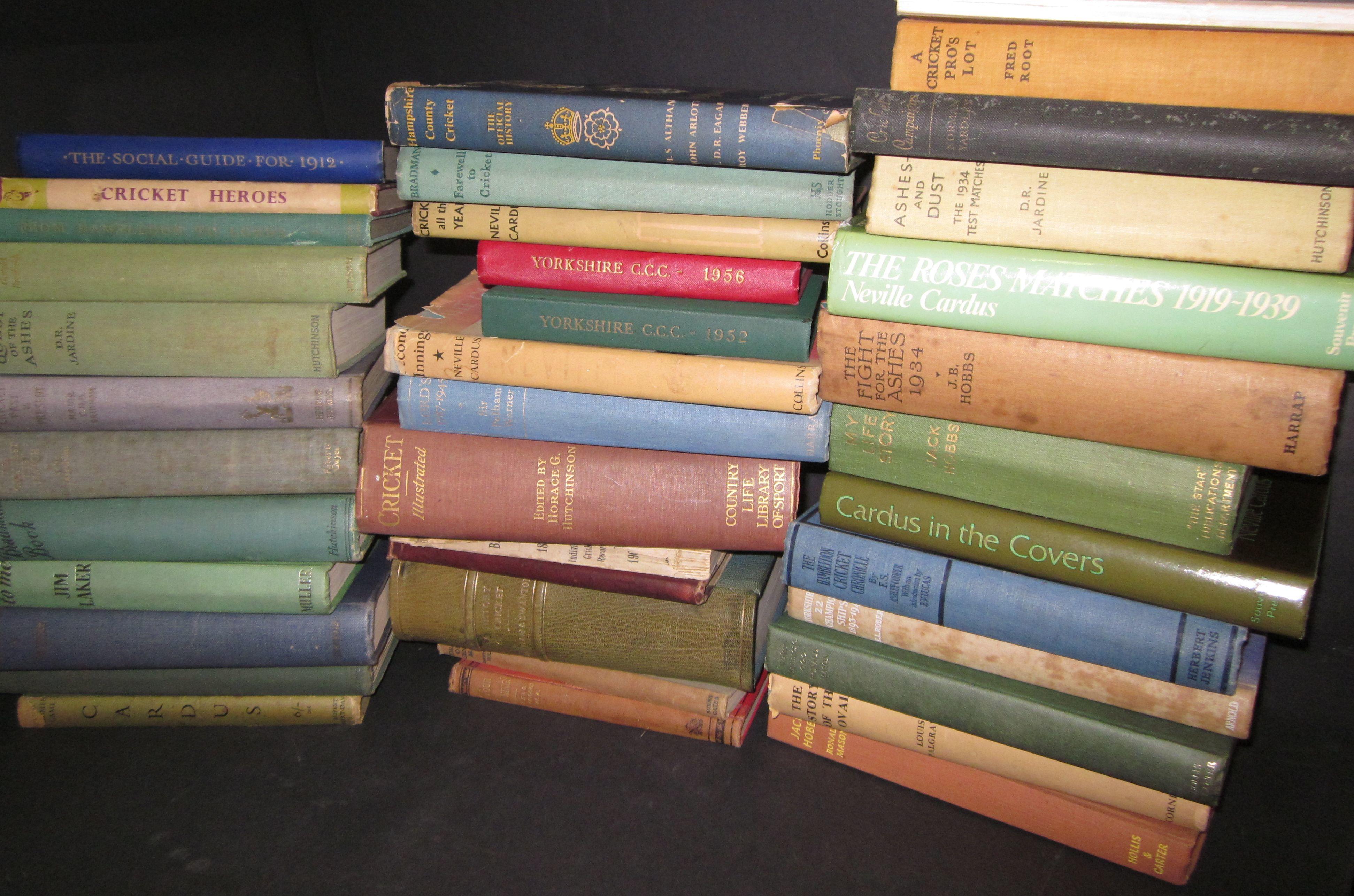 A large collection of various cricket books