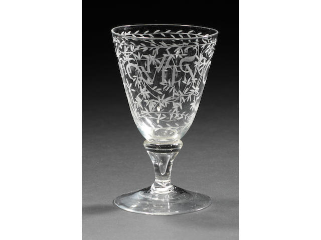 A very rare small engraved Queen Mary baluster wine glass, circa 1680-90