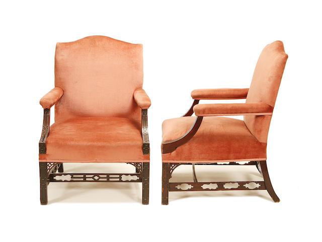 A pair of late Victorian mahogany 'Gainsborough' armchairs in the Chippendale style