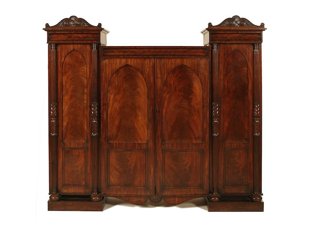 A George IV mahogany triple wardrobe