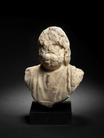 A Roman marble bust of a god