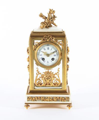 A late 19th century French Louis XVI style white marble and gilt brass mounted mantel clock