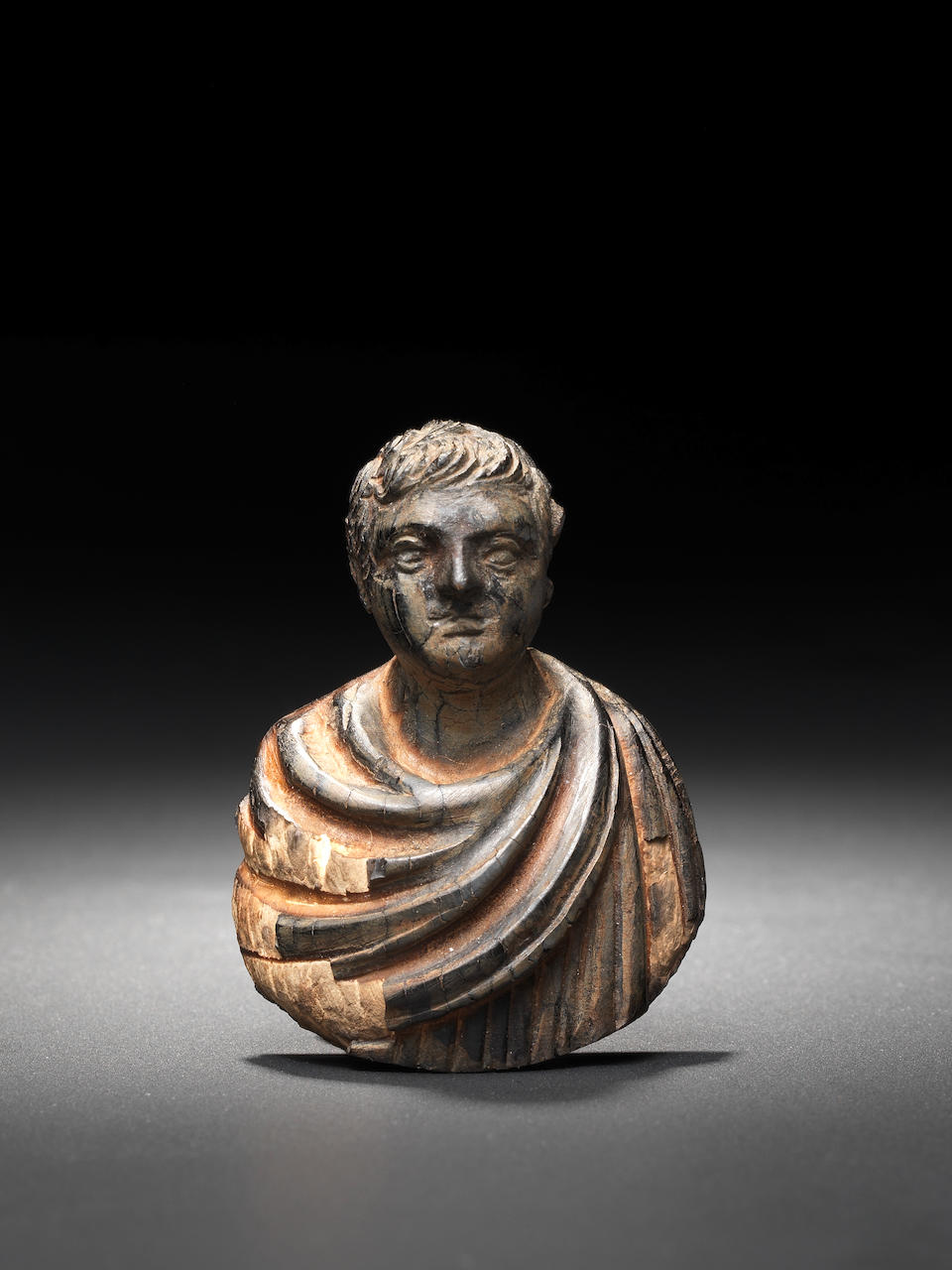 A Roman wood bust of an emperor
