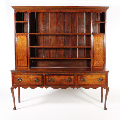 A George III oak and mahogany crossbanded dresser