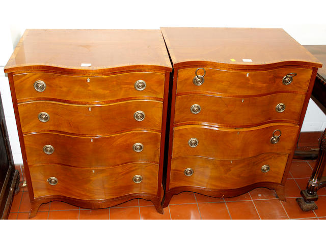A pair of reproduction mahogany and crossbanded serpentine chests,of four drawers on swept bracket feet, 66cm wide