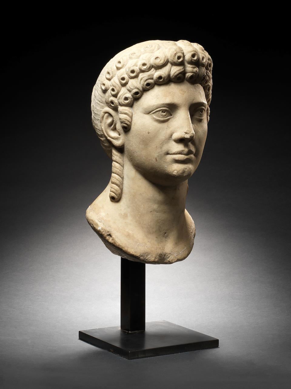 A Roman marble archaistic head of a kore