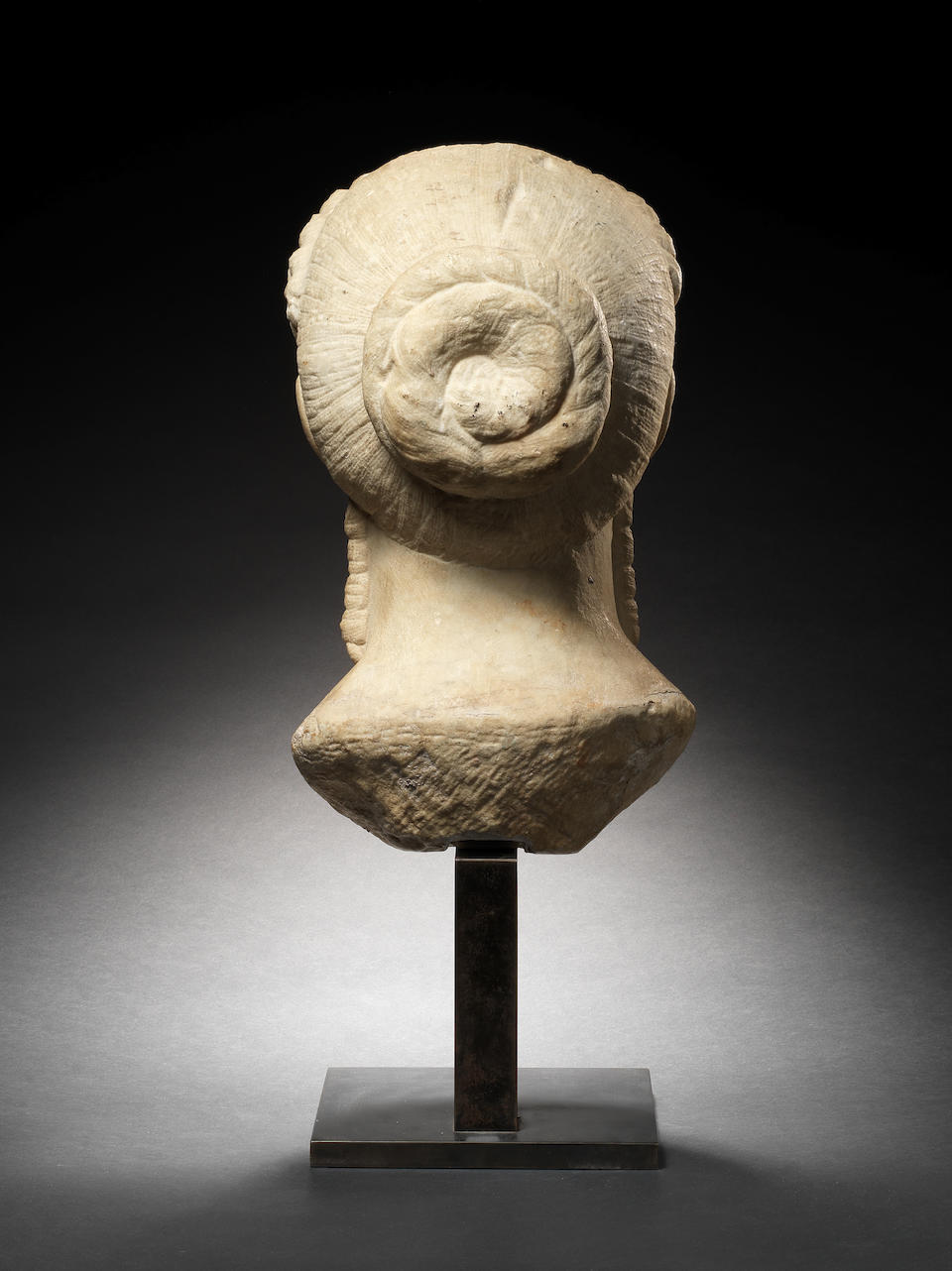 A Roman marble archaistic head of a kore