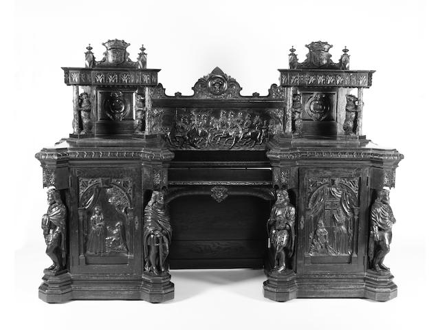 A late 19th century carved oak twin pedestal sideboard based on the 'Kenilworth Buffet' of 1851 by Cookes and Son of Warwick