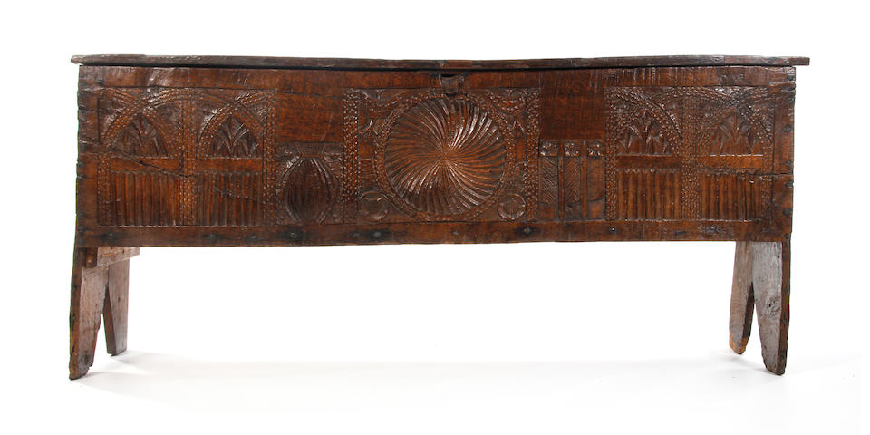 An exceptionally rare carved oak boarded chest, circa 1500.