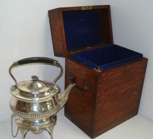 A late Victorian silver tea kettle on spirit heater stand,William Hutton & Sons, Sheffield 1900, in Regency style, oval part lobed and fluted, 34cm, 50ozs, in fitted oak baize lined case retailed by Army & Navy C.S.L.