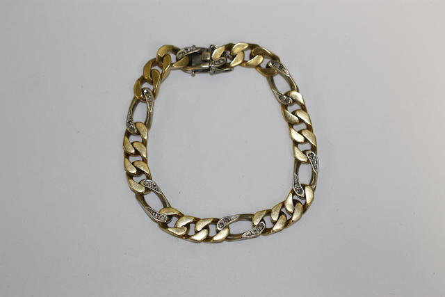 A flattened curb-link two colour diamond set bracelet