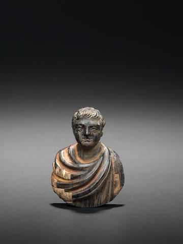 A Roman wood bust of an emperor