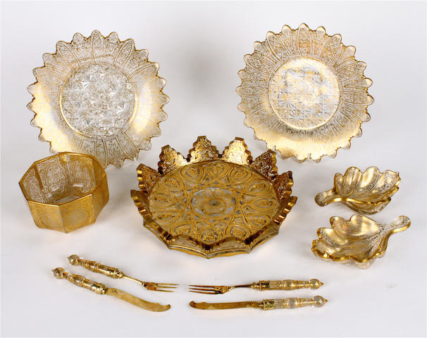 A suite of Venetian style gilt decorated glass