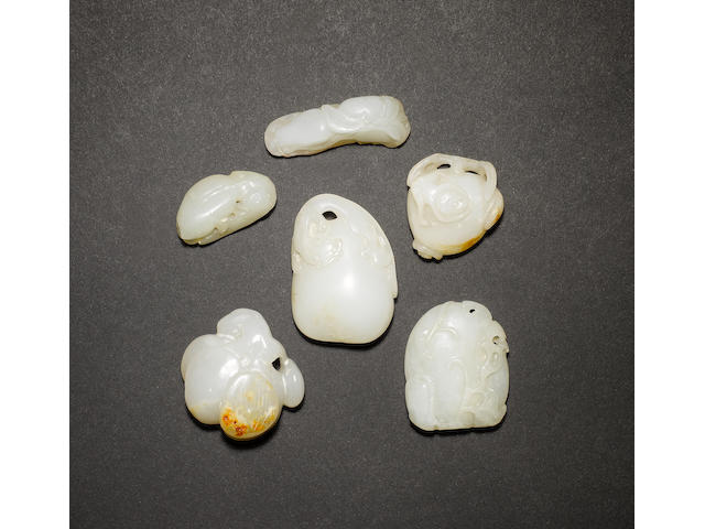 A group of six small jades, all carved with a Natural History theme