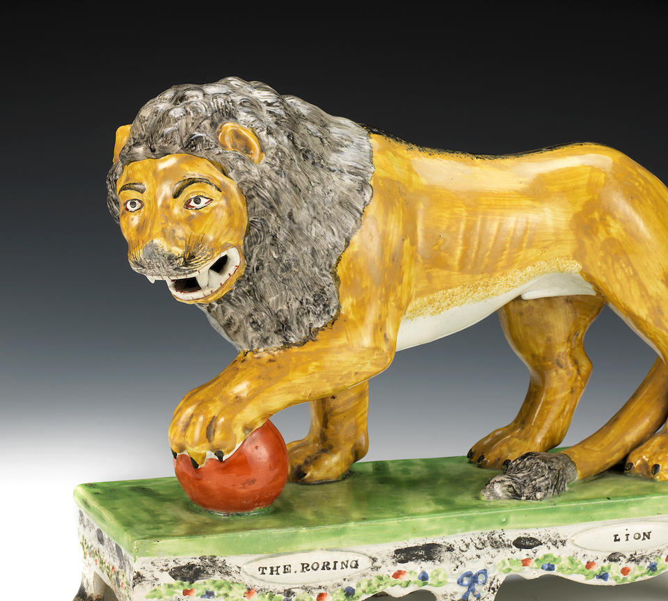 A remarkable pair of Staffordshire models of a tiger and a lion, circa 1830