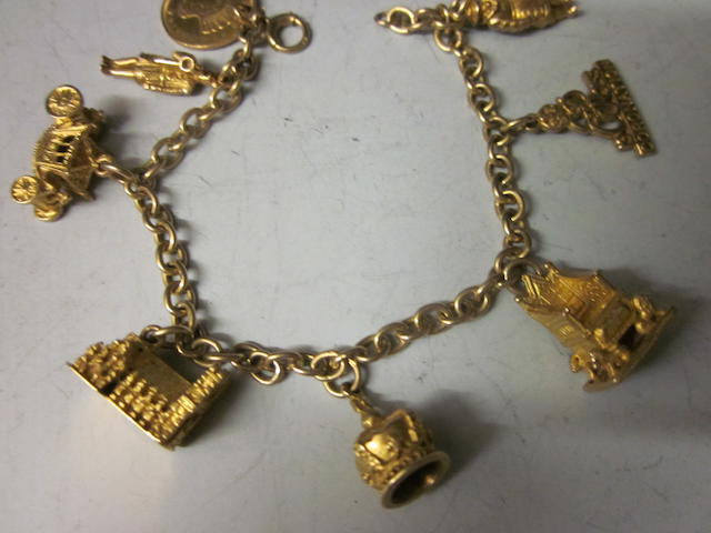 Bonhams : A 9 carat gold charm bracelet,