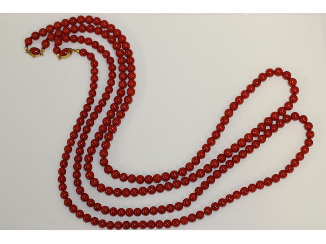Two single strand red coral bead necklaces