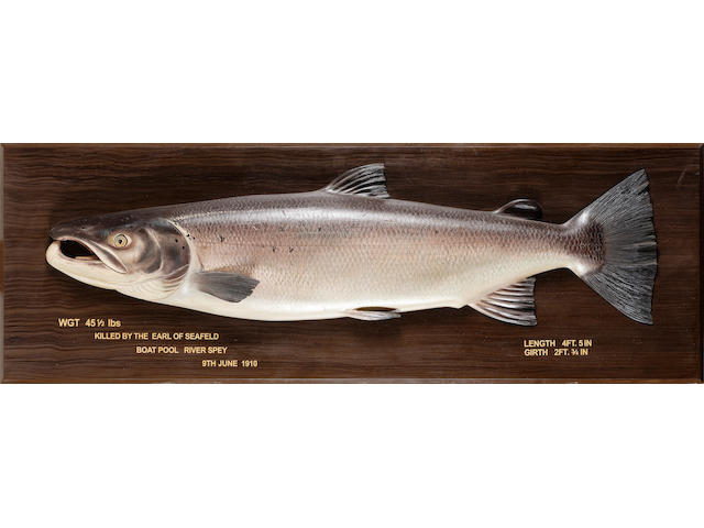 A carved cock salmon 153cm (60in.) wide overall.