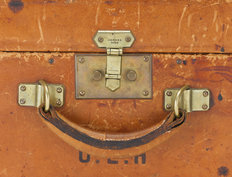 HERM&#200;S: A tanned leather suitcase,