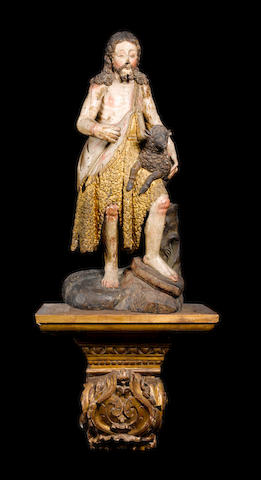 A Spanish late 17th / early 18th century carved wood, parcel gilt and polychrome decorated figure of Saint John the Baptist