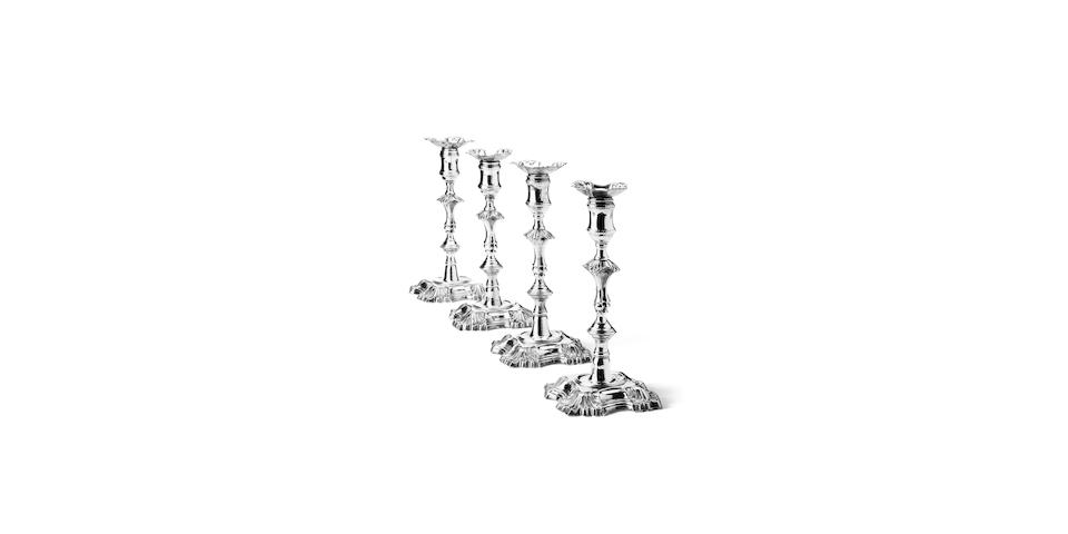 A set of four George II silver candlesticks By John Cafe, London 1748