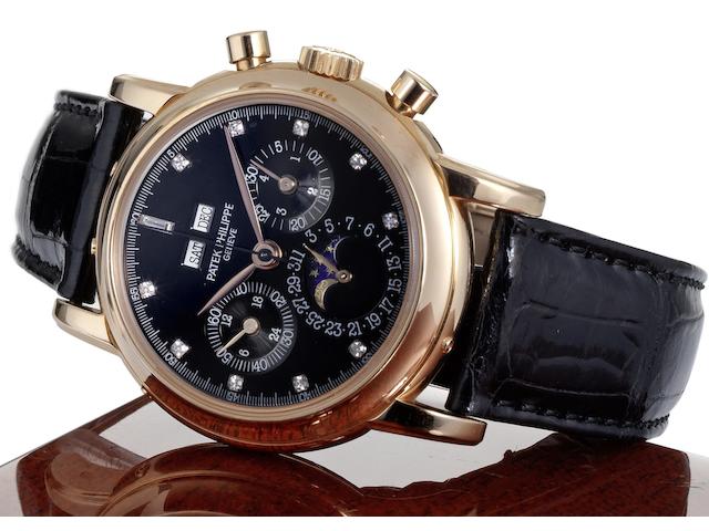 Patek Philippe. A very fine and very rare 18ct rose gold and diamond black dial manual wind perpetual calendar chronograph wristwatch together with fitted Patek Philippe box, setting tool and Extract from ArchivesRef:3971E, Case No.2870012, Movement No.875483, Made 1989, Sold January 18th, 1990