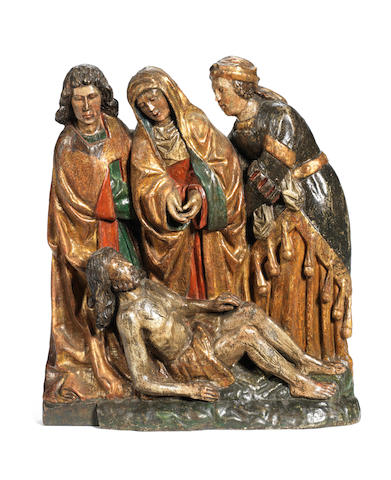 A Flemish early 16th century carved wood and polychrome decorated figural group of the Deposition