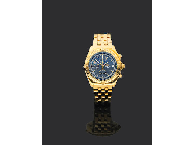Breitling. An 18ct gold automatic chronograph bracelet watch