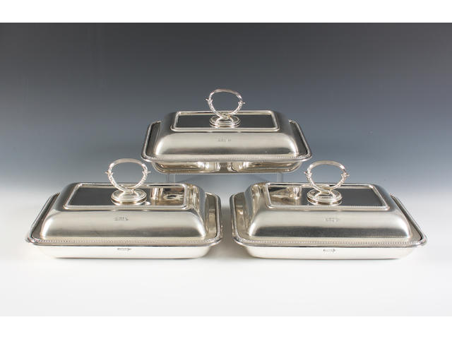 A set of three late Victorian silver entre&#233; dishes and covers By Mappin & Webb, Sheffield, 1900,
