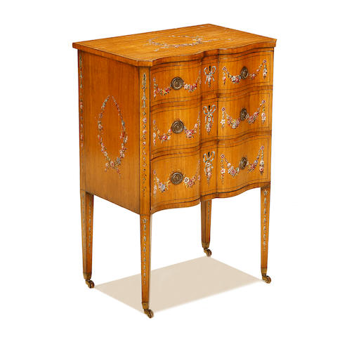 An Edwardian satinwood and polychrome decorated petit commode in the Sheraton revival style