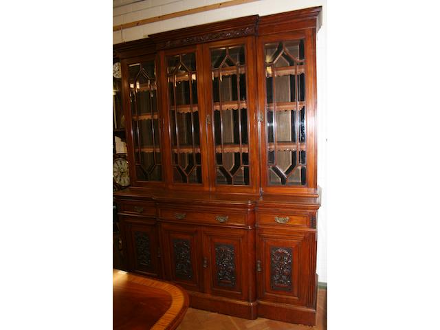 A late Victorian walnut breakfront library bookcase