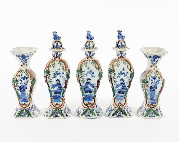 A Dutch Delft garniture of three vases and covers and two beaker vases, 19th century