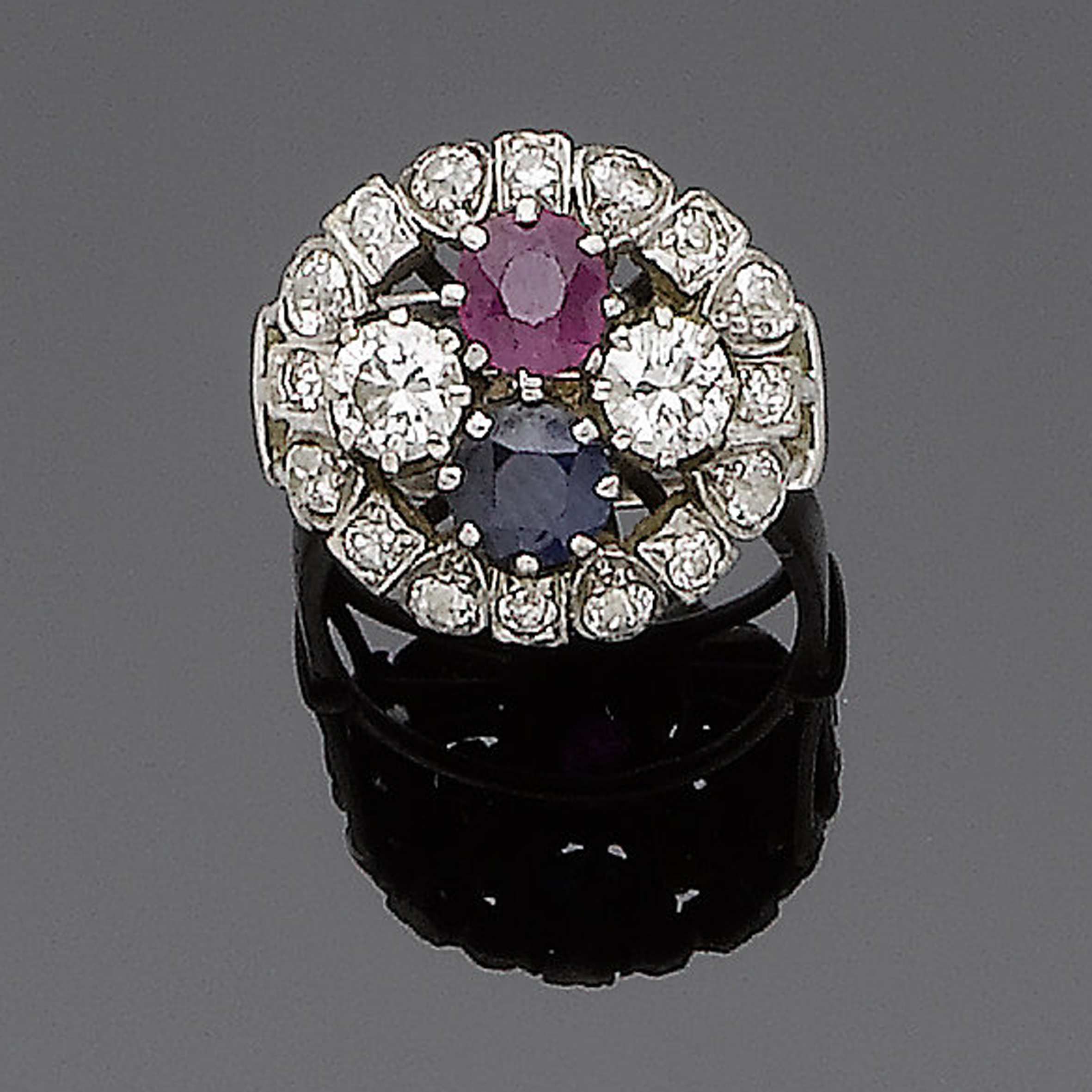 A ruby, sapphire and diamond cluster ring