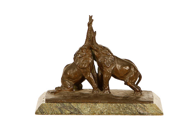 A bronze model of two elephants dated 1937