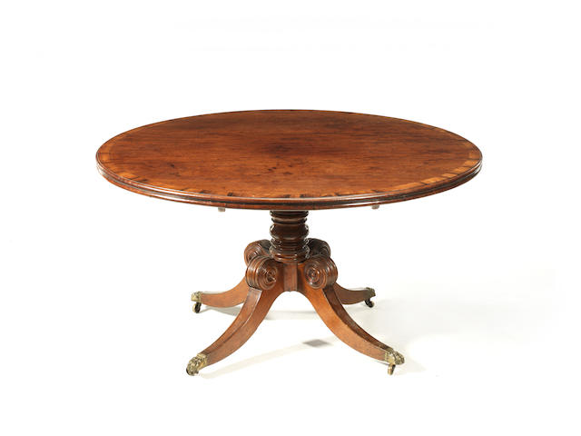 A Regency Irish mahogany and rosewood crossbanded circular breakfast table