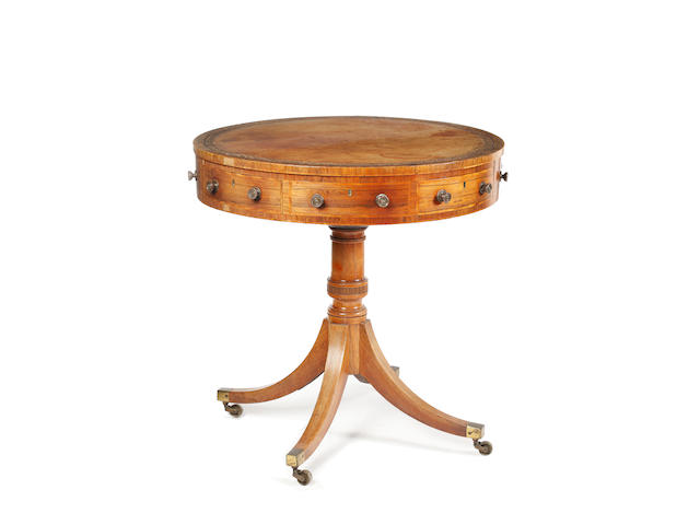 A Regency style rosewood revolving drum table