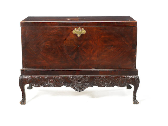 A George III Irish mahogany, crossbanded and parquetry coffer on carved stand