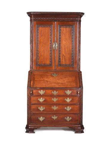 A George III Irish carved mahogany bureau cabinet