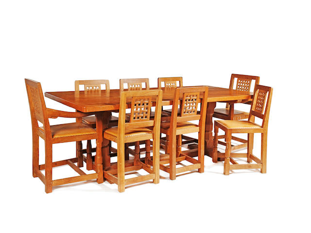 By Robert "Mouseman" Thompson of Kilburn: An oak dining table and eight chairs