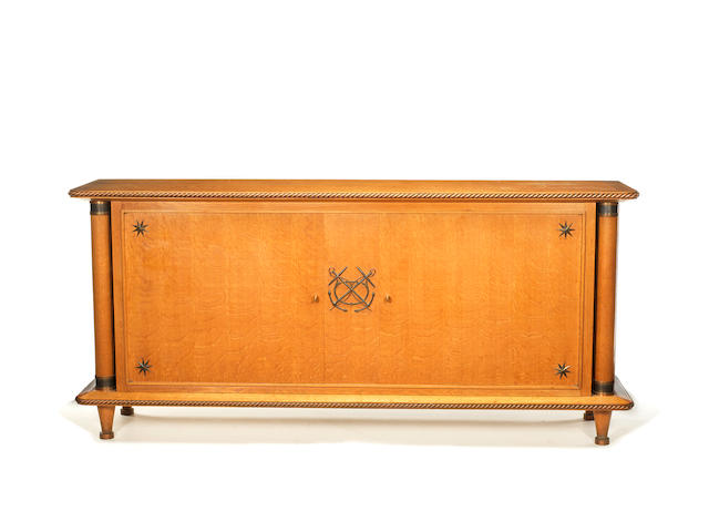 Sideboard French, circa 1935 in the style of Pierre Lardin  oak and gilt metal, the twin doors with keys opening to reveal an interior with two sections each with adjustable shelf  95 by 206 by 51 cm. 37 3/8 by 81 1/8 by 20 1/16