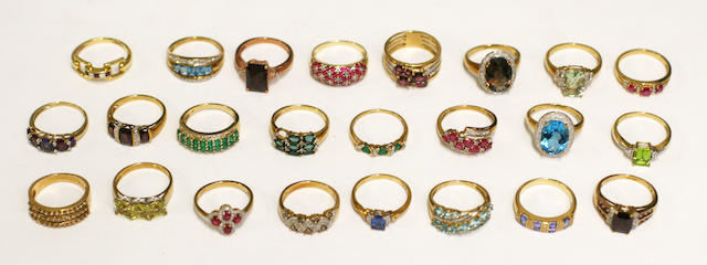 A collection of 24 yellow precious metal diamond and gem set rings, (24)