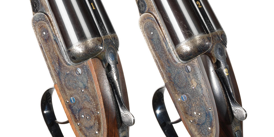 A fine pair of 12-bore self-opening sidelock ejector guns by J. Purdey & Sons, no. 28301/2 In their leather motor case with canvas cover