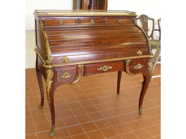 A late 19th century Louis XV style mahogany bureau in the form of a 'bureau du roi'