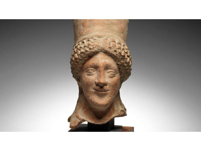 A Greek terracotta head of a kore