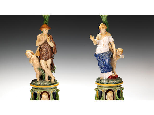 A pair of large Minton Majolica figural candelabra, dated 1878
