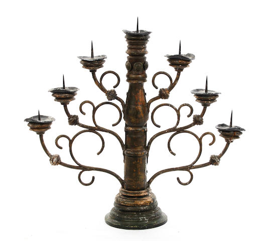 A polychrome-painted wooden six-branch candelabrum