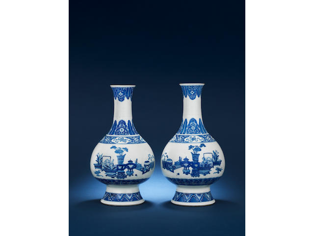A pair of blue and white, pear-shaped vases