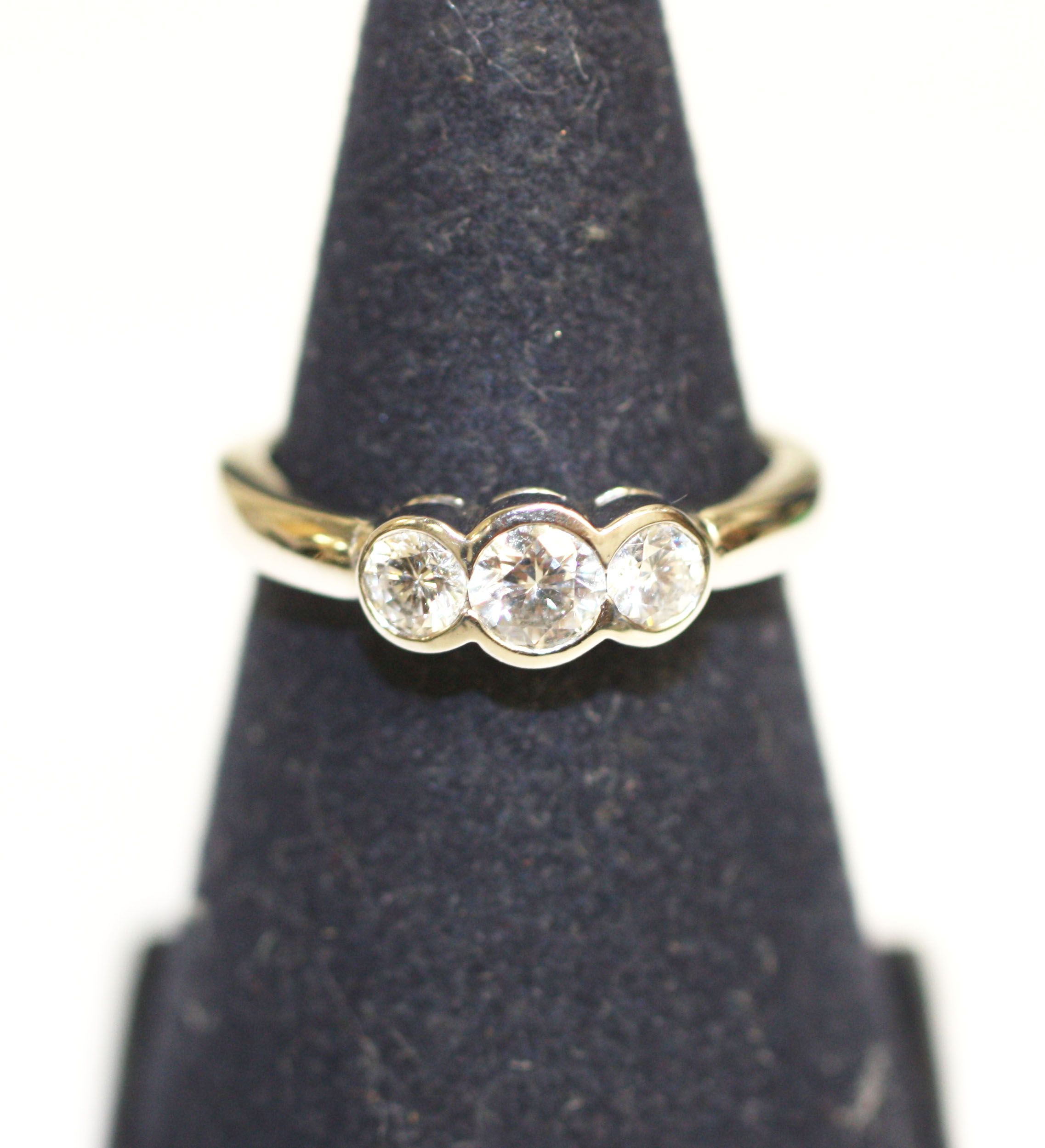 A diamond three stone ring,