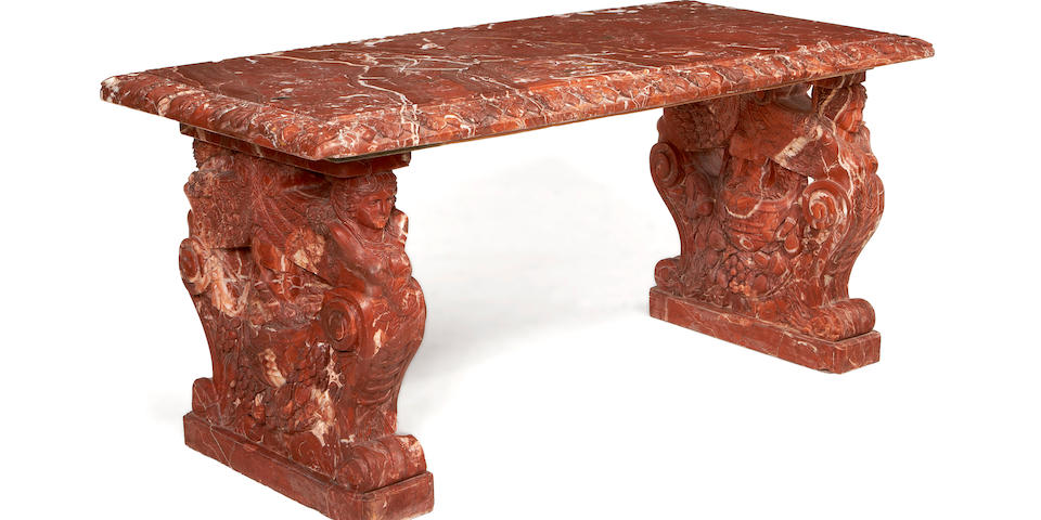 An impressive carved Rouge Royale marble centre table in the Baroque style