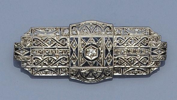 A diamond set panel brooch